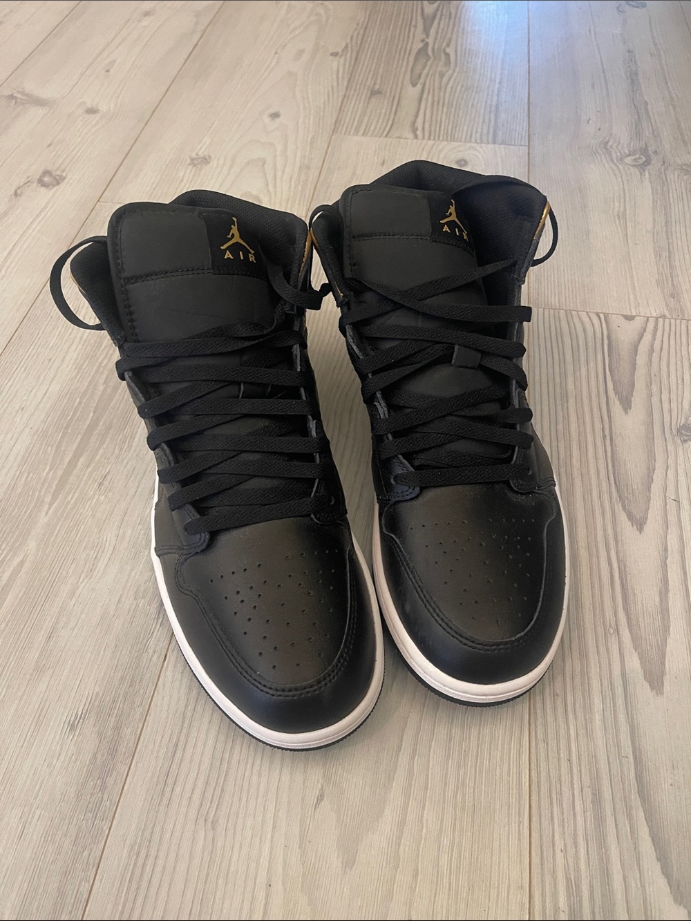 Jordan 1 Men’s Black and Gold Sneakers with White Midsole